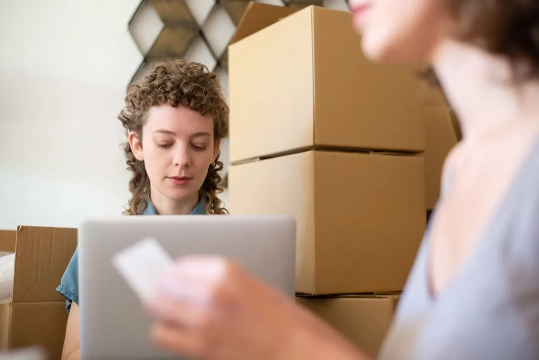 Ecommerce team managing online store orders with a laptop