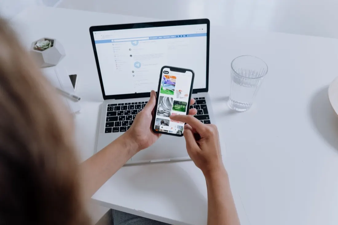 Product designer testing a mobile app on a smartphone