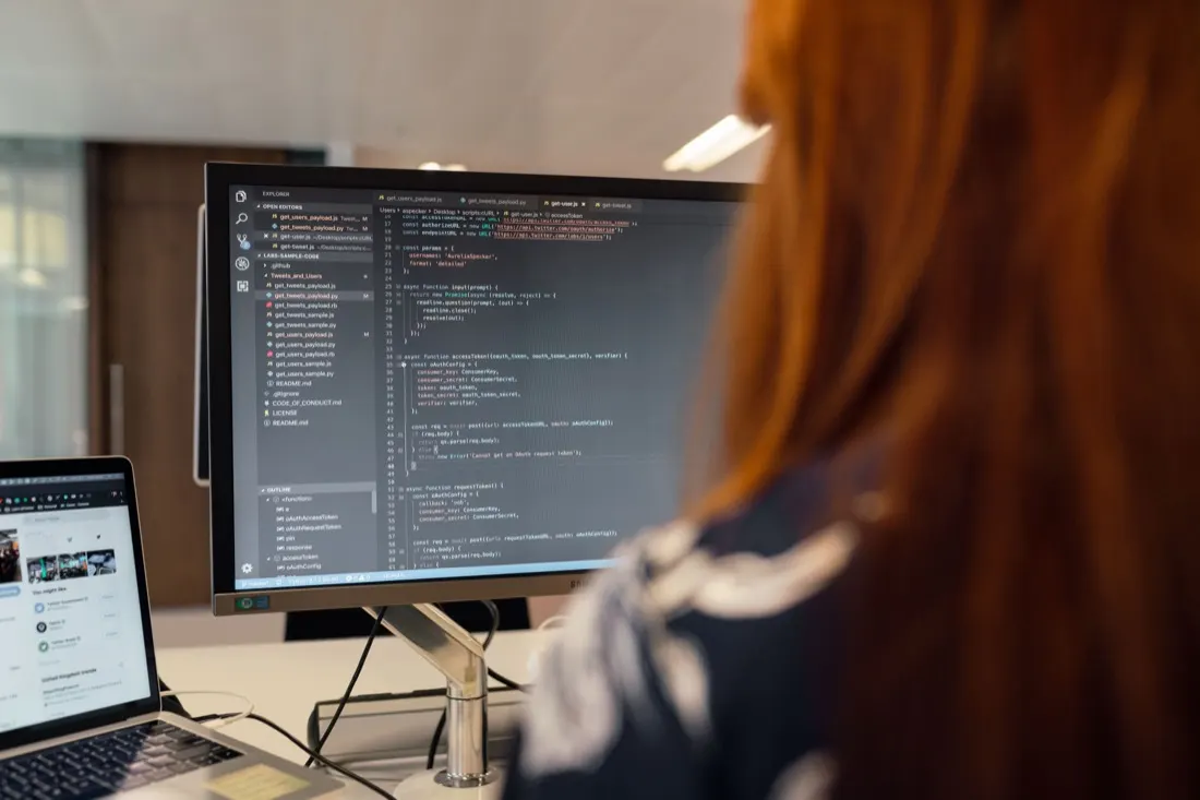 Engineer writing code for a custom web application