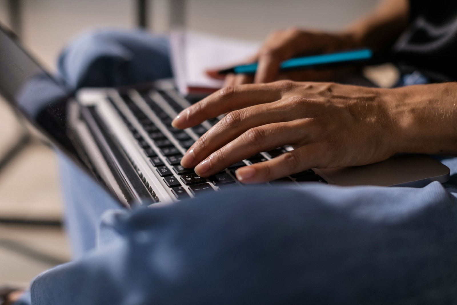 Person typing a content draft on a laptop