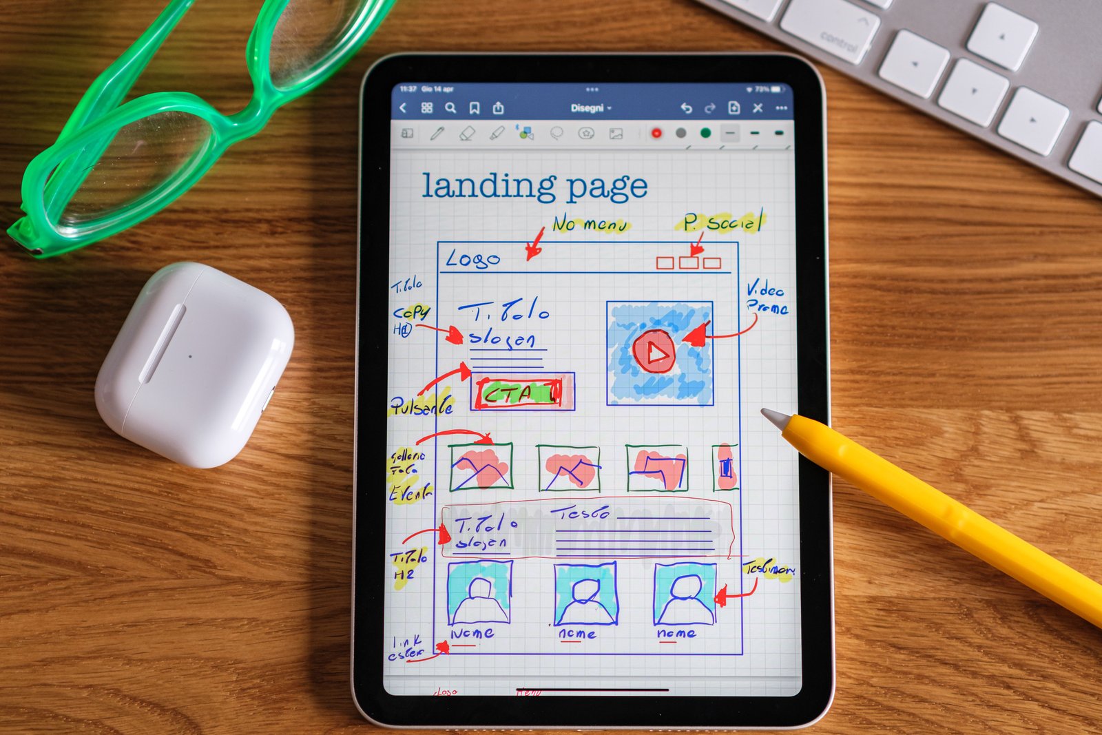 Tablet showing landing page design sketches for conversion work