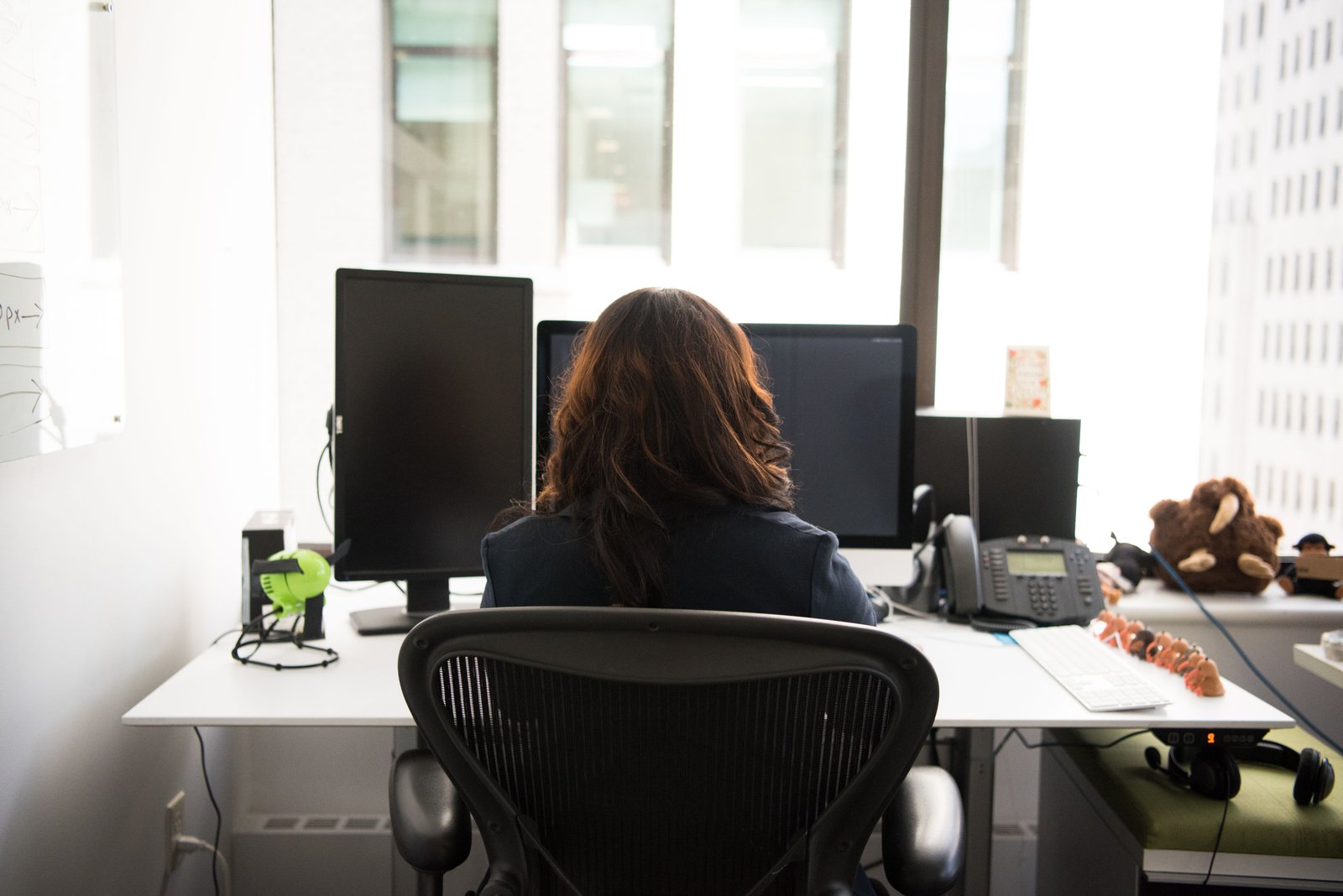 Marketing specialist reviewing paid performance at a desktop